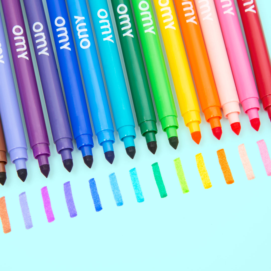 Set of colorful markers with 'omy' branding on a light blue background