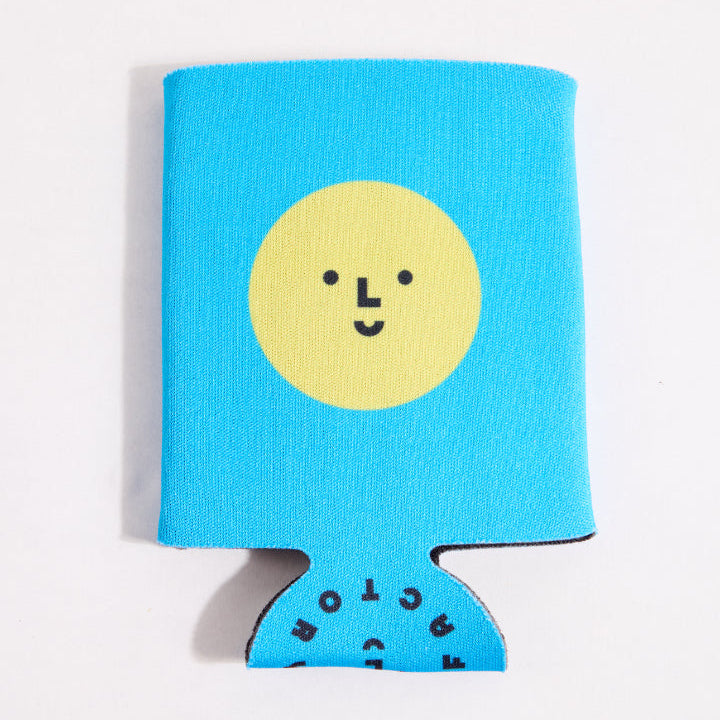 Blue can cooler with a yellow smiley face and black text on a white background