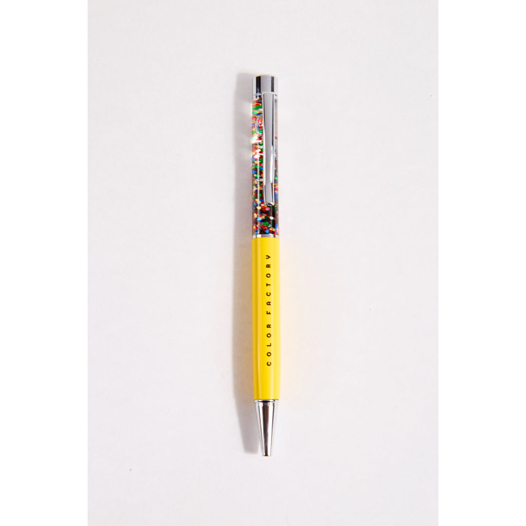 Yellow confetti pen with 'Color Factory' branding on a white background
