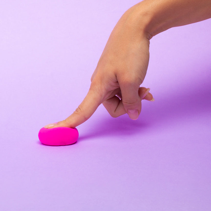Hand interacting with a pink 'do' on a purple background