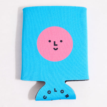 Blue can cooler with a pink circle and smiley face on a white background