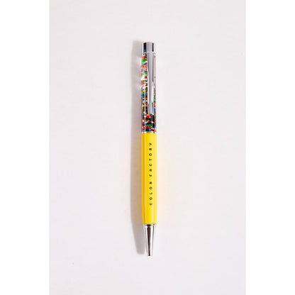 Yellow confetti pen with 'Color Factory' branding on a white background