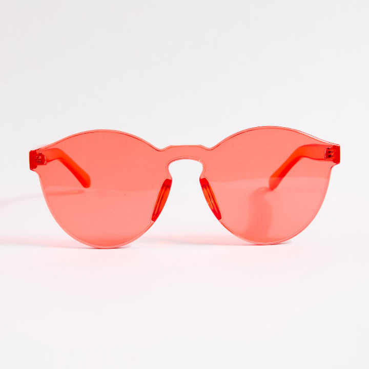 Red sunglasses on a white background