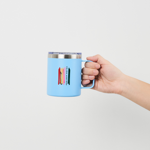 Hand holding a Blue Stainless Steel Winter Colorland Mug