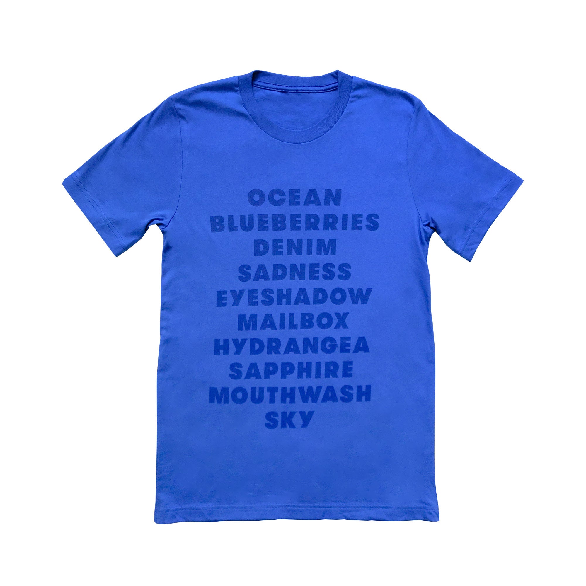 A bright blue, adult t-shirt with a list of "blue" items printed on the front (in dark blue ink). List includes happy items (like "ocean") as well as funny items (like mouthwash).